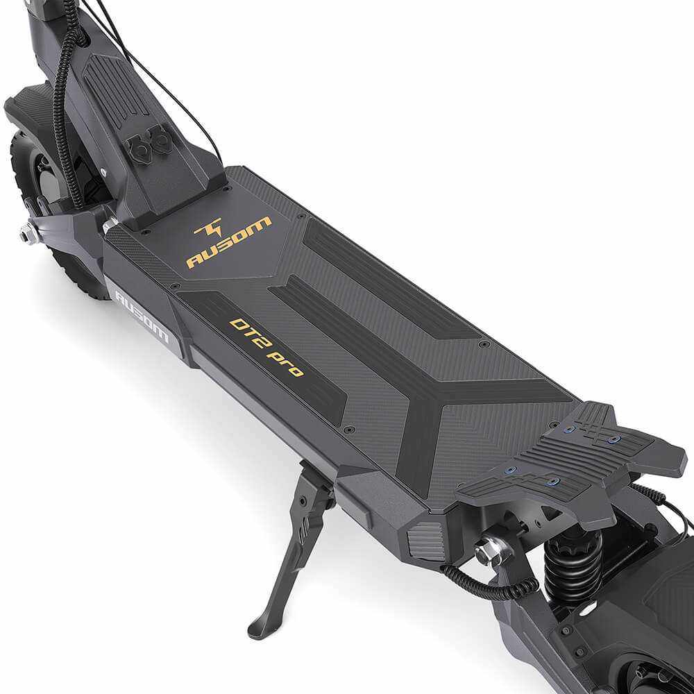 Close-up of Ausom DT2 Pro electric scooter deck featuring 52V 23.4Ah battery, dual 1100W brushless motors, 10"x3" tubeless rubber tires, and foldable kickstand.