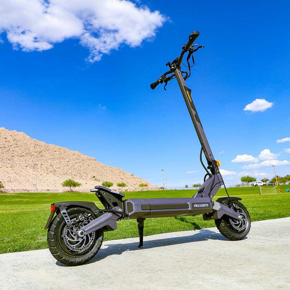 Ausom DT2 Pro electric scooter with dual 1100W motors, 52V 23.4Ah battery, 42 mph max speed, 71 miles range, and 10-inch tubeless tires outdoors on pavement
