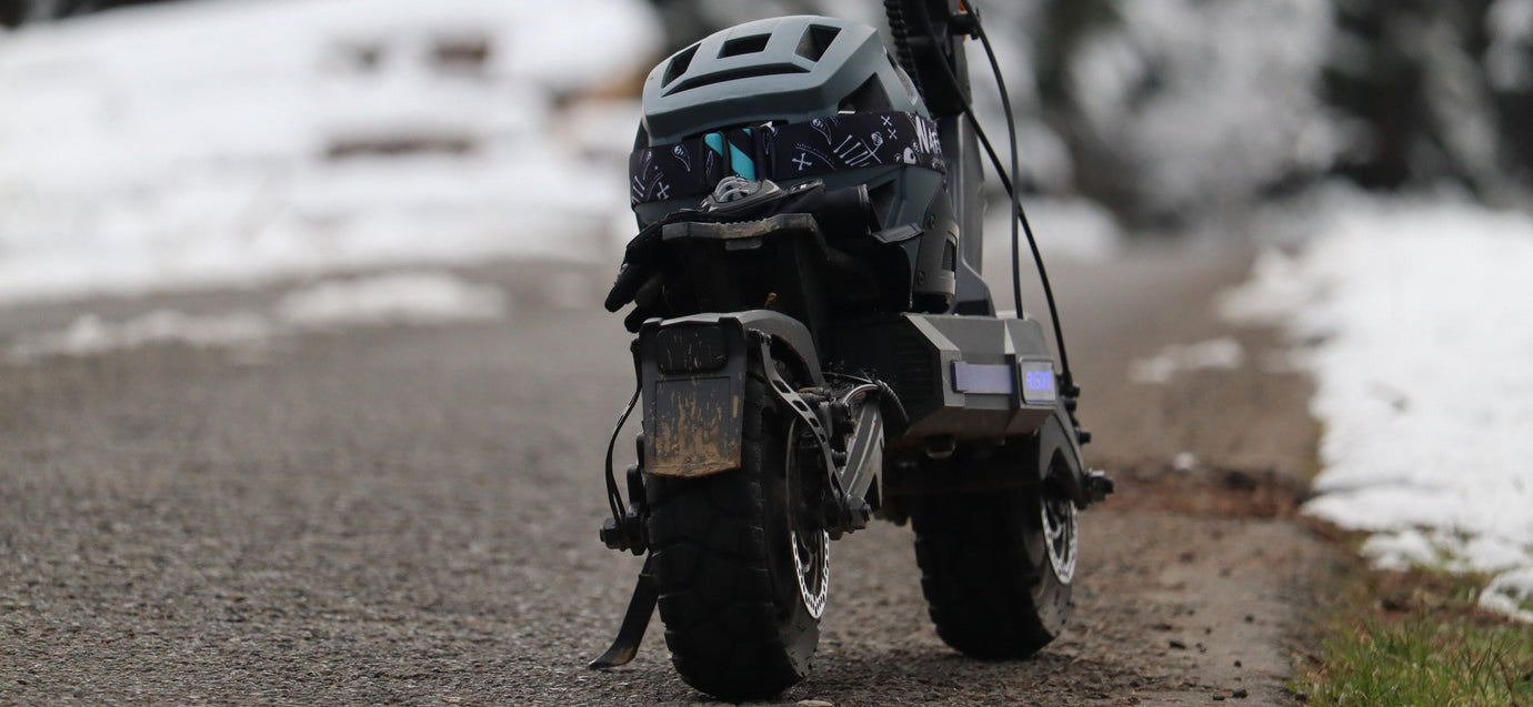 Off-road dual motor electric scooter exploring mountain trails