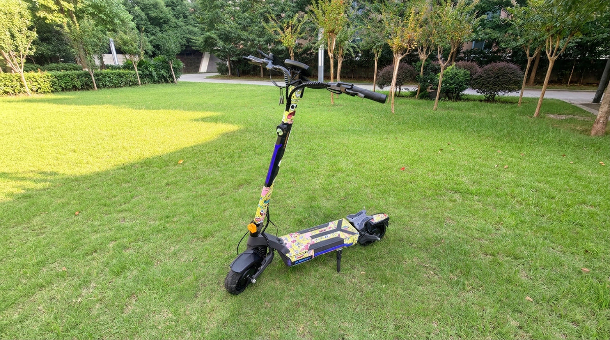 Colorful custom-wrapped electric scooter parked on grass